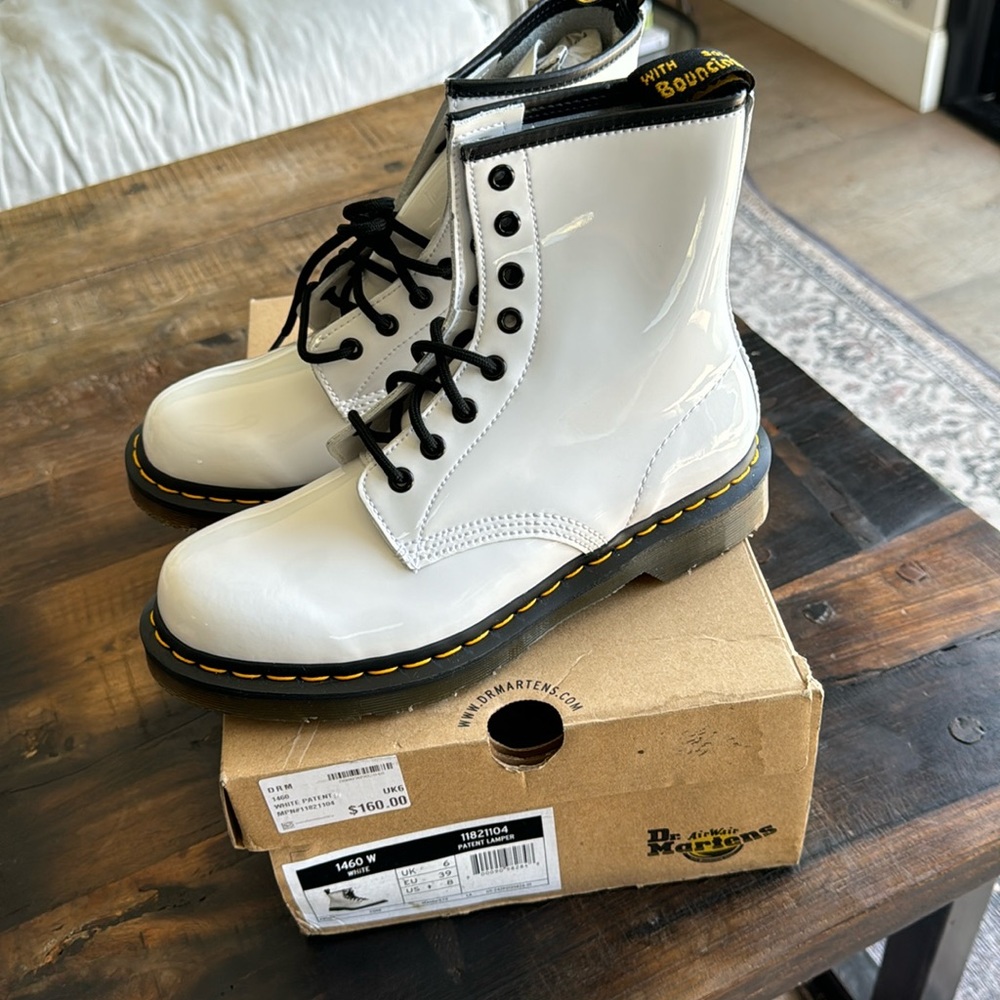 Brand New with box white patent leather Dr. Martens boots. Never worn.